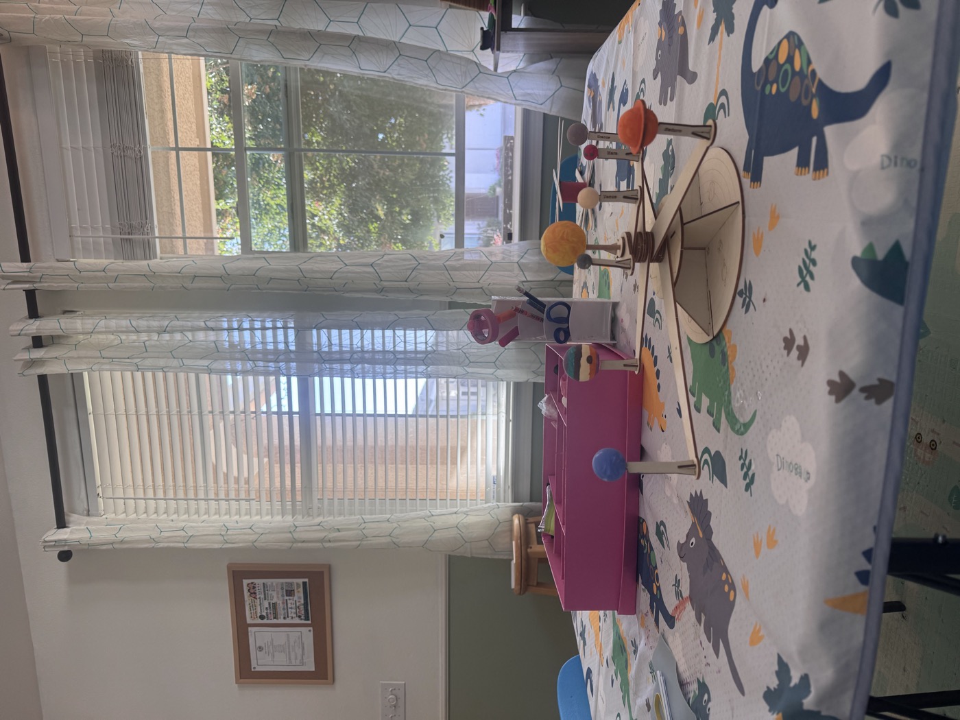 Handmade solar system model on the classroom project table